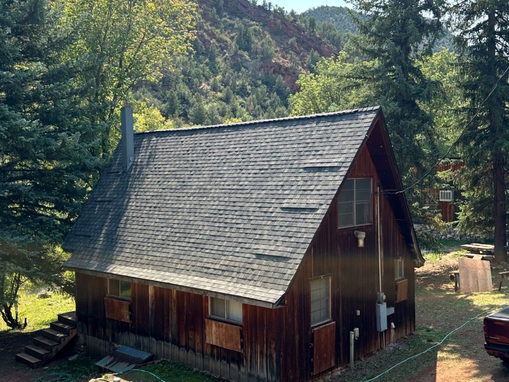 After: a fully restored cabin roof, replacing the failed cedar shake