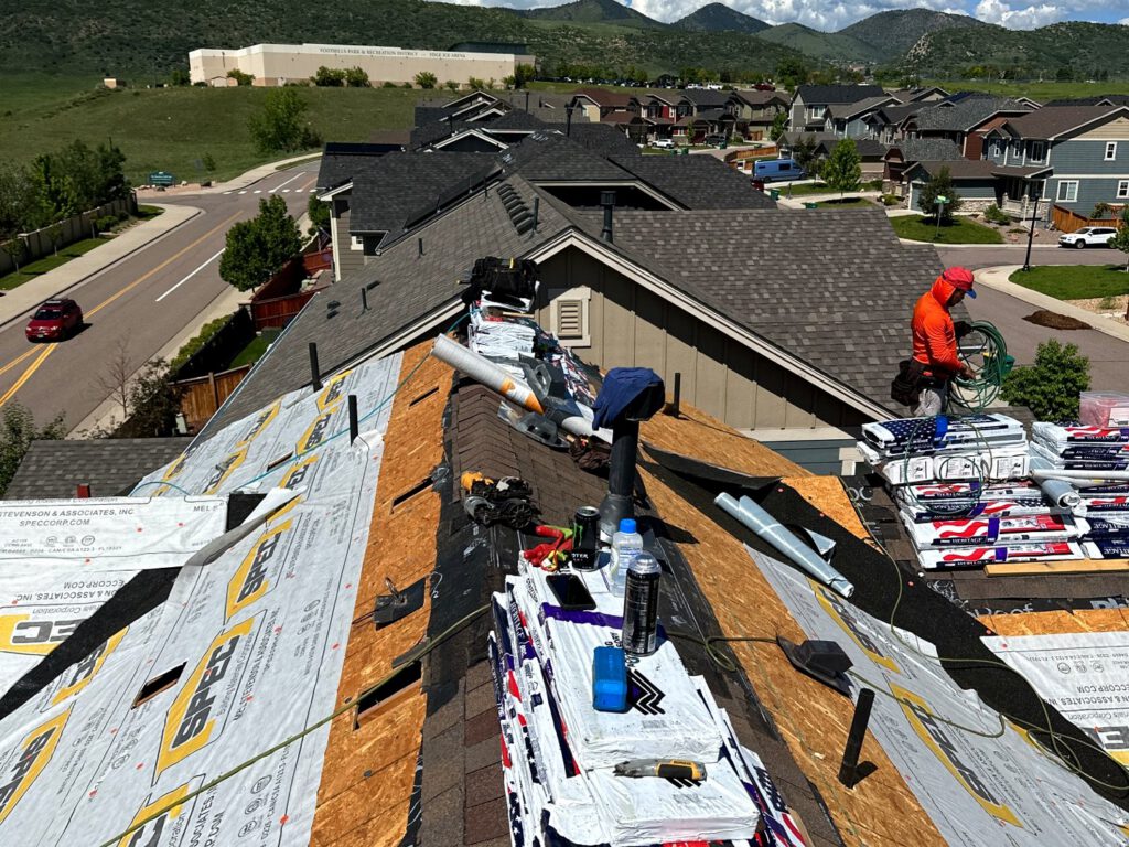 Our crew installing new architectural shingle