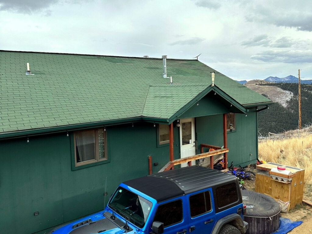 A mountain home with a metal accent roof