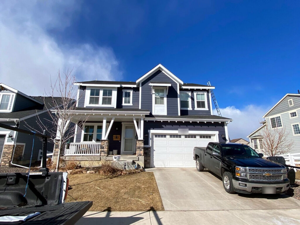 A completed roof replacement on a suburban home