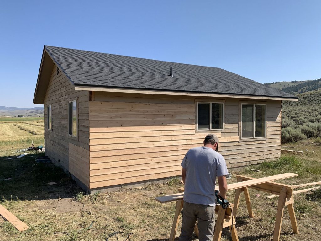Ranch home getting a new roof and new siding at the same time