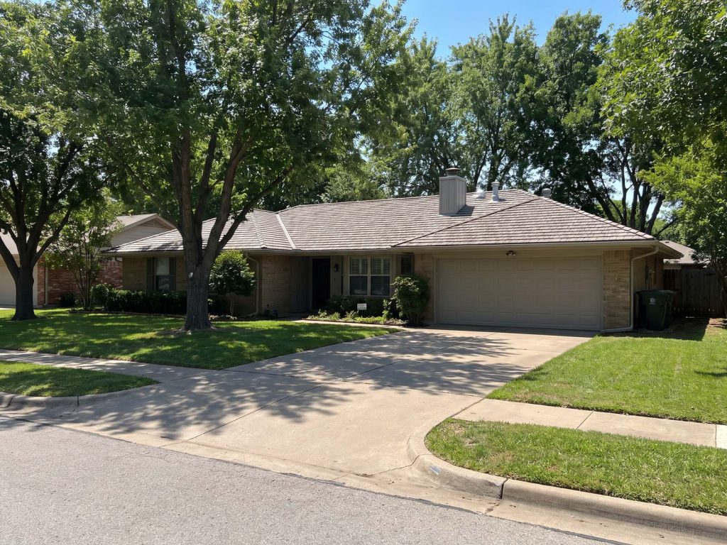 Family home with a freshly replaced roof seen from the curb
